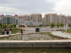 20 Kashgar Donghu East Lake Lotus Pond With Modern Buildings Behind.jpg